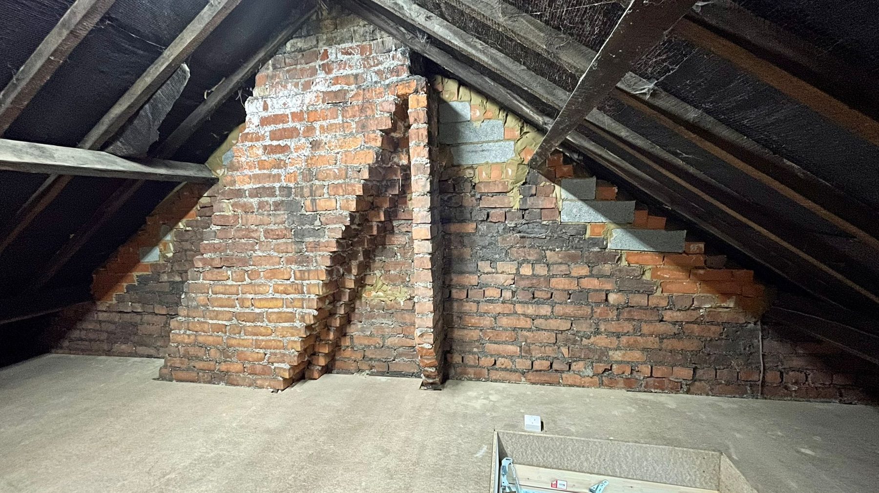 A customer's loft with the shared loft space bricked up, in an 1876 terrace