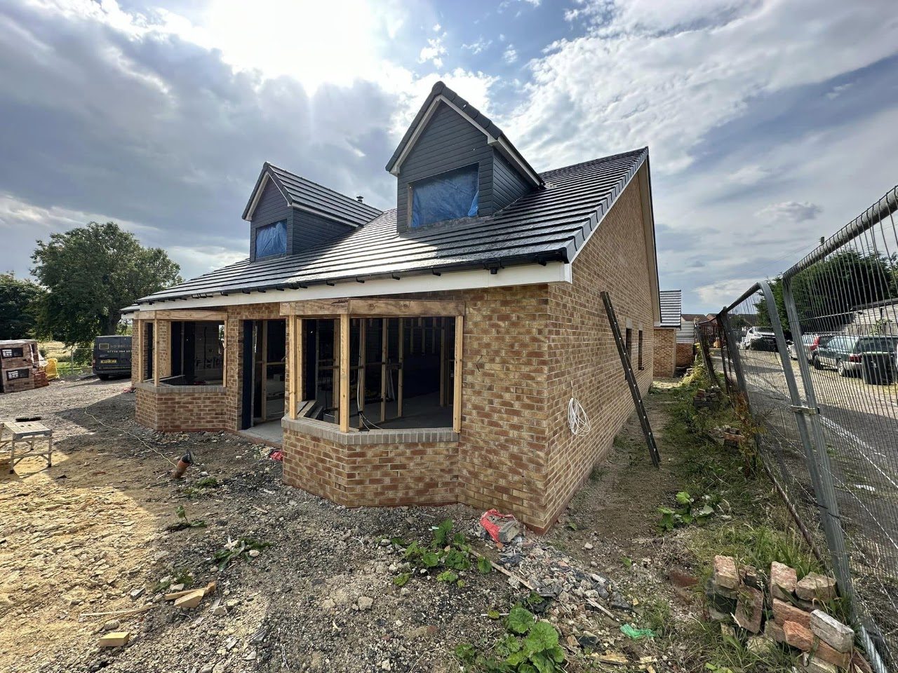 A dormer bungalow new build by WD Brickwork, brickwork rising to the roofline
